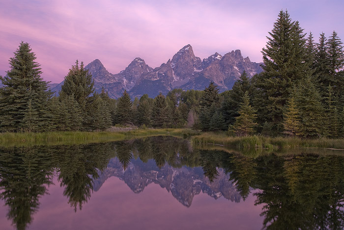 Calm conditions and soft pre-dawn light accentuate this classic view of the Teton range at Swabacher's Landing.   Field Notes...